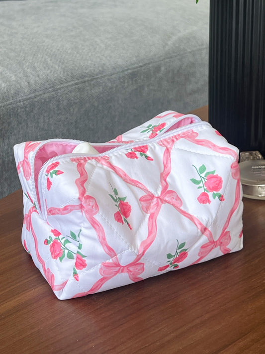 pink makeup bag with bows and roses. Use for makeup, skincare and beauty essentials