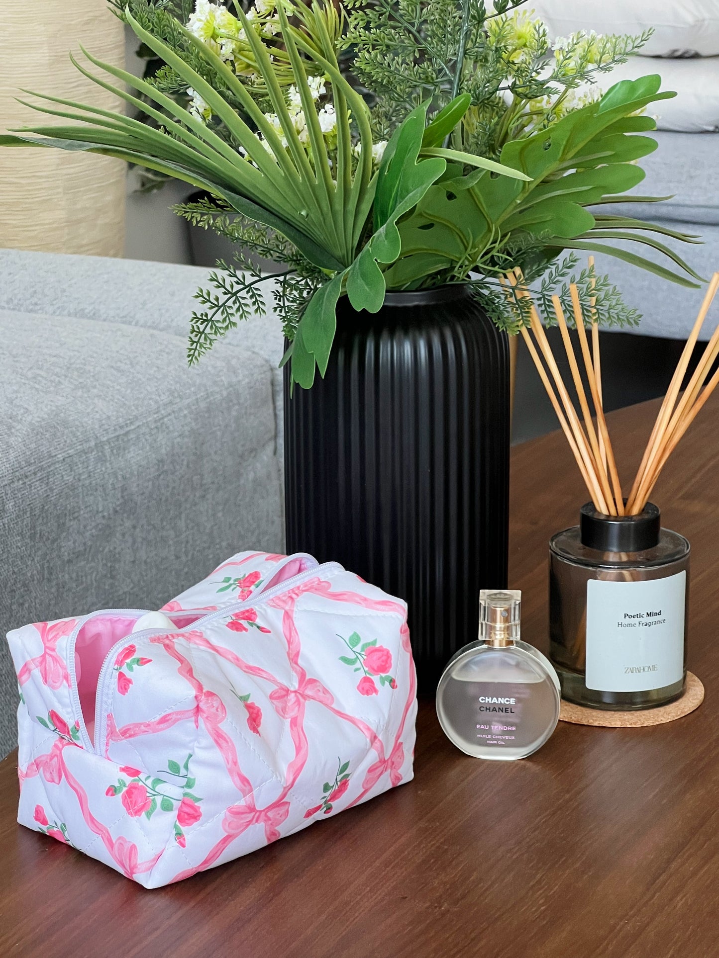 Pink makeup pouch with bows and roses. Perfect for makeup, skincare and travel.