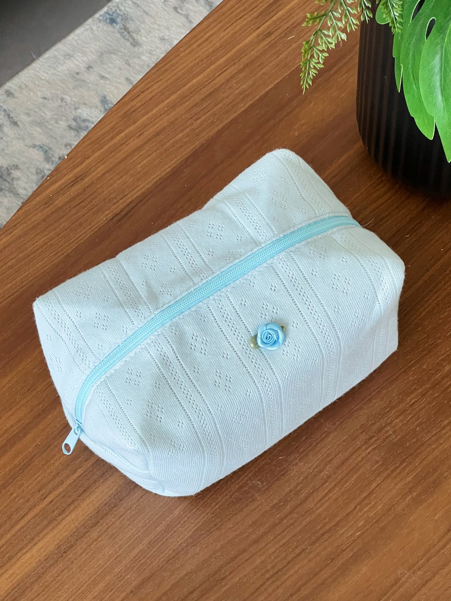 Blue beauty pouch with rose. Aesthetic trabel bag. Perfect for makeup, skincare and more