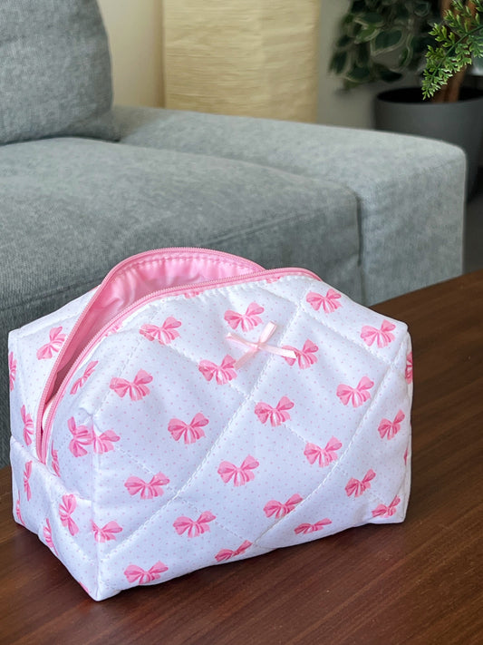 pink makeup pouch with cute little bows. Beauty pouch for makeup, skincare and beauty essentials.
