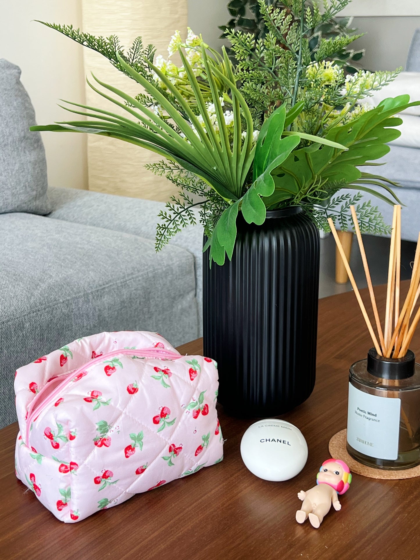 Pink makeup bag with a strawberry design. Good for makeup, skincare and beauty essentials.