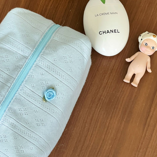 blue beauty pouch. makeup bag. travel bag. 