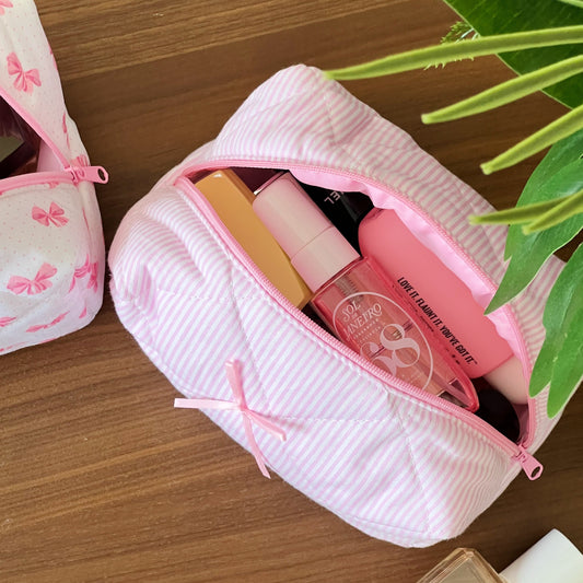 pink makeup pouch with bow. Use for skincare. makeup and travel.