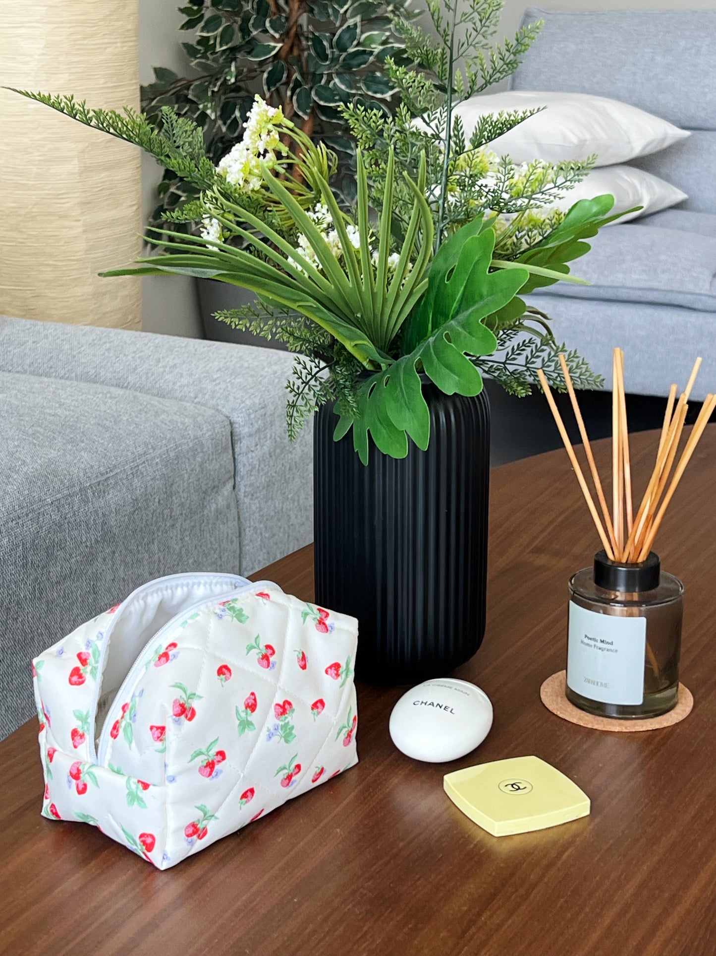 Yellow beauty pouch with strawberry designs. Perfect for travel, skincare and makeup.