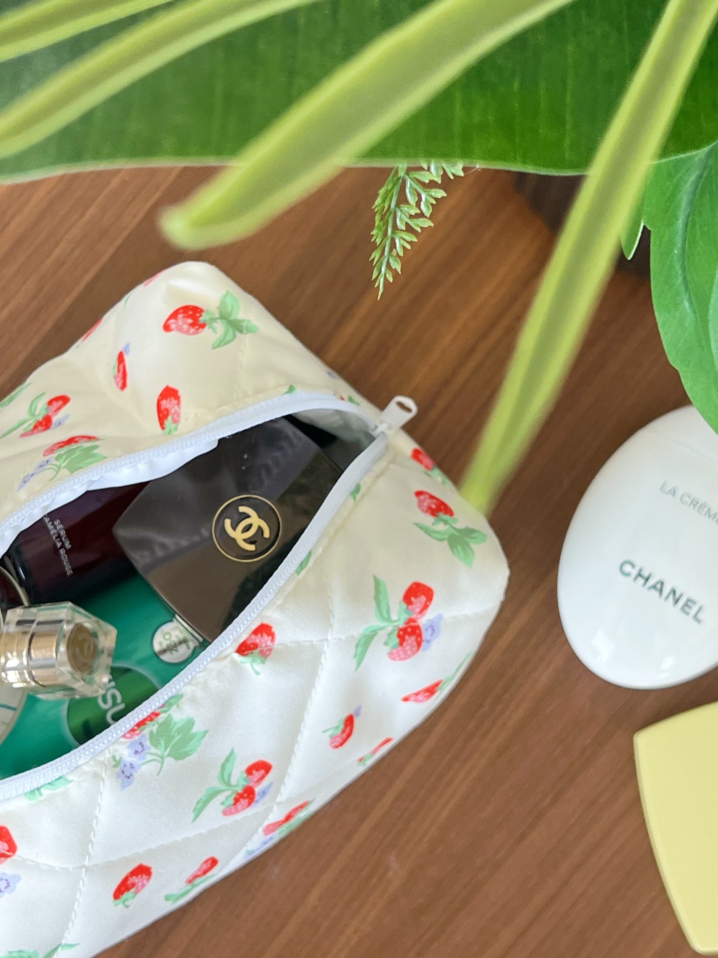 Yellow beauty bag with strawberry designs. Perfect for travel, skincare and makeup.