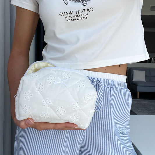 white embroidered makeup bag