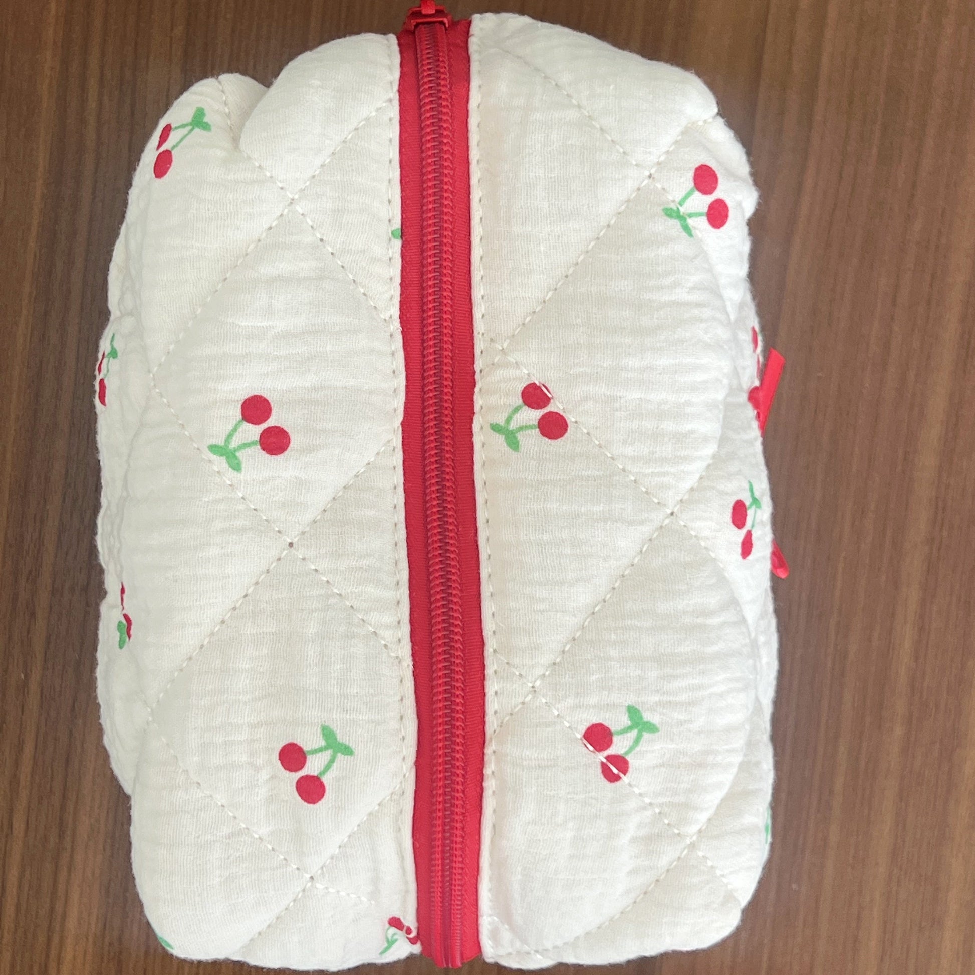 Makeup bag with cherry designs. Perfect for makeup, skincare and travel.