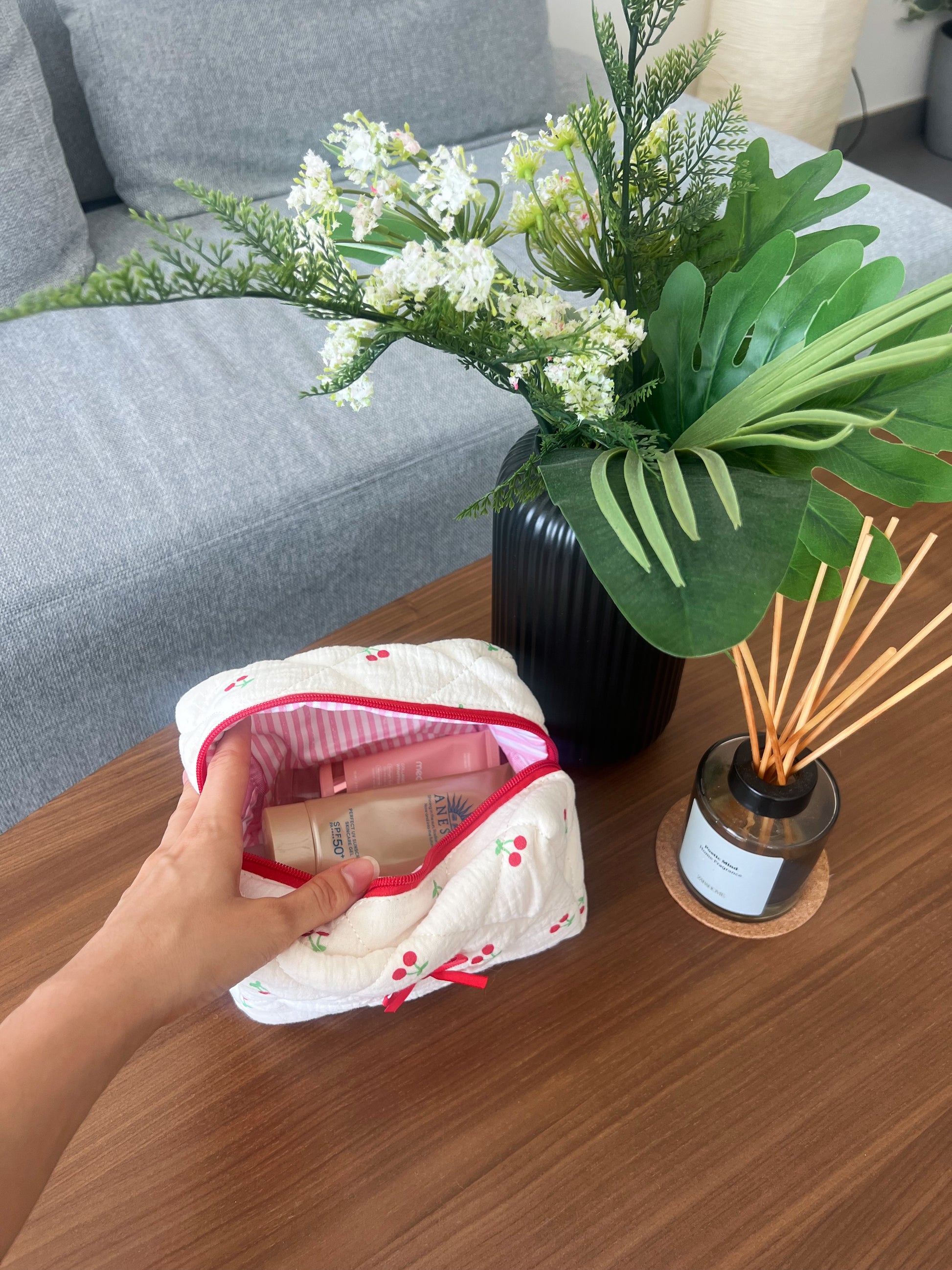 Beauty bag with cherry designs. Perfect for makeup, skincare and travel.