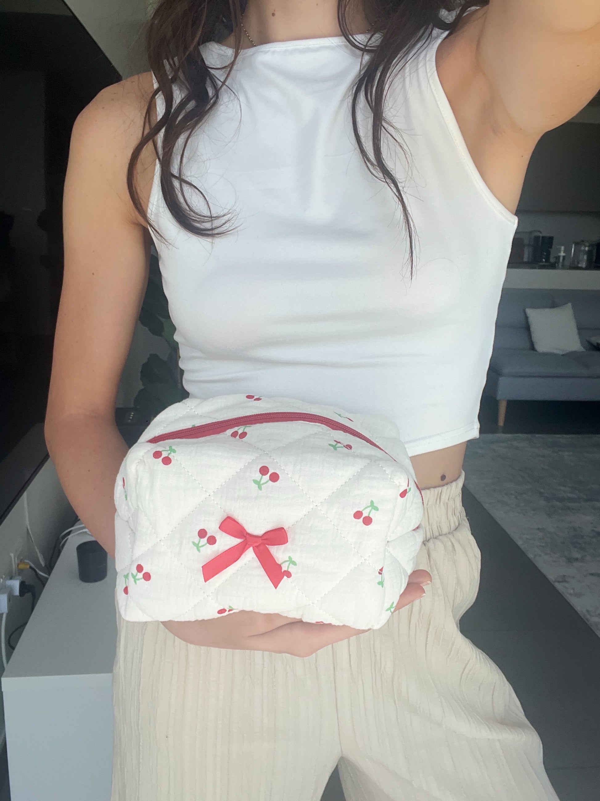 Makeup bag with cherry designs. Can fit all your essentials.