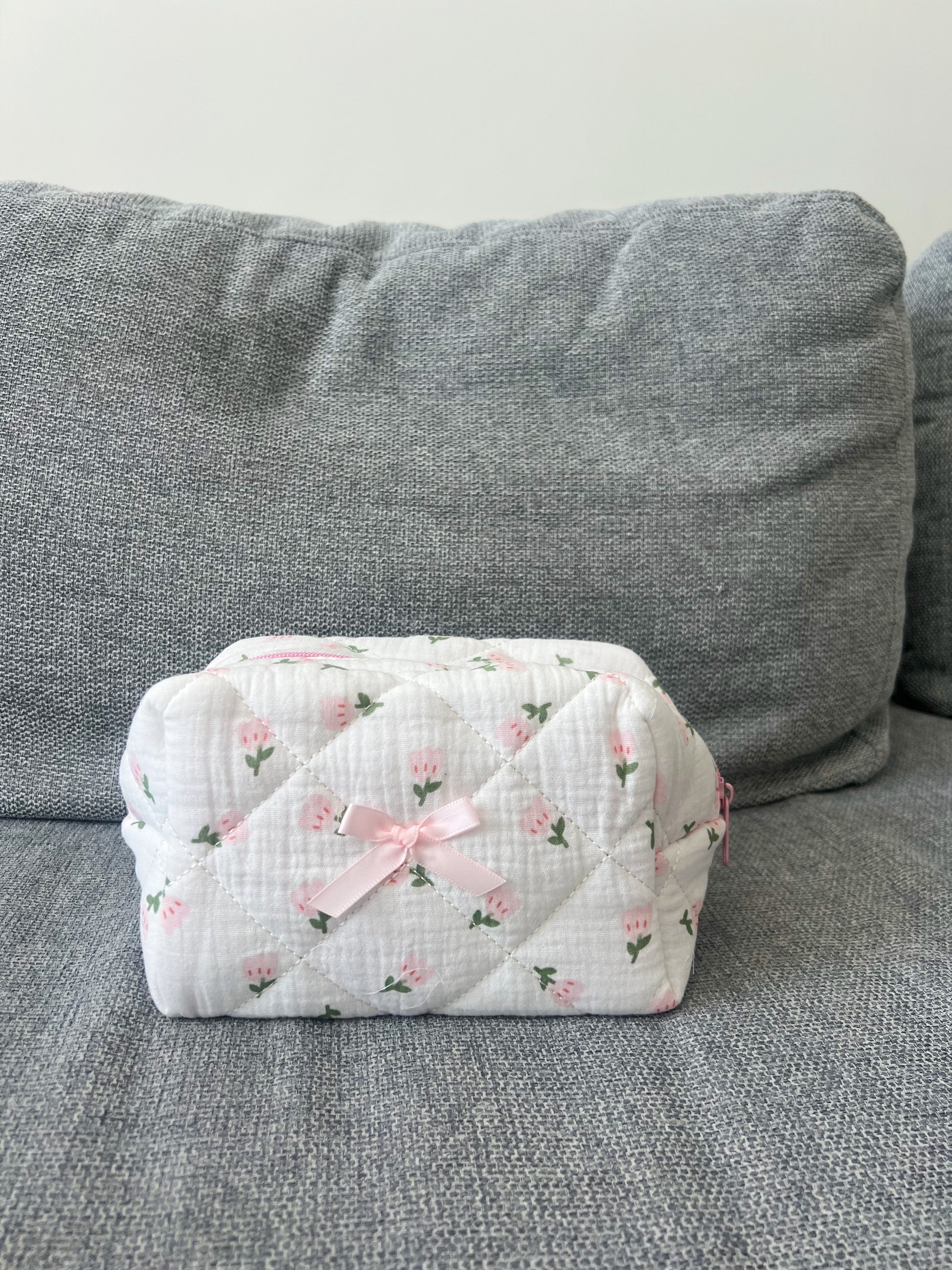 Beauty bag with flower designs. Sweet and soft. Can fit skincare, makeup and more. Good for travel as well.